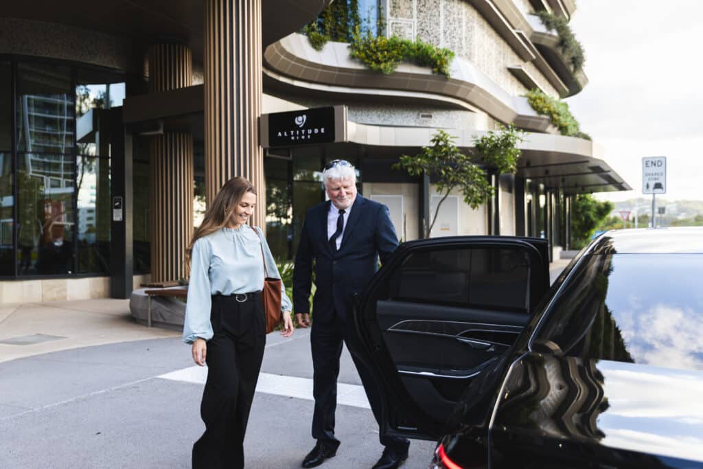 Business woman being escorted by a professional travel agency.