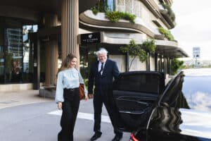 Business woman being escorted by a professional travel agency.