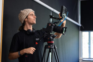 Videographer operating a camera